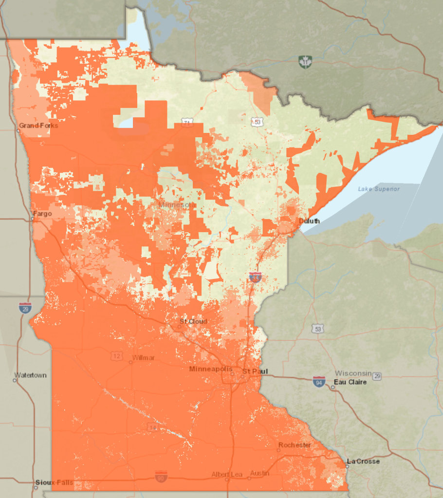 Map of geographies with with minimum 25/3 internet speeds. Areas not shaded in orange are considered underserved or unserved. Most unshaded area is in the north eastern part of Minnesota. 